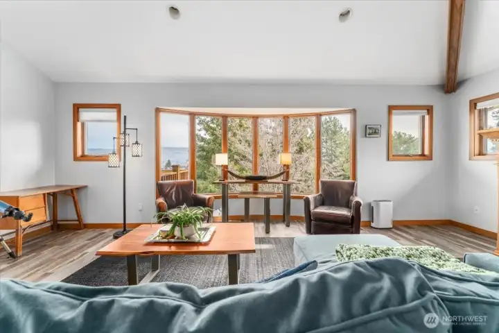 Anderson windows frame the view of the park like yard and city & mountain views