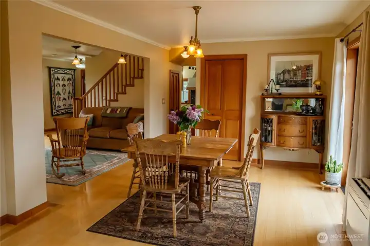 Main house floor 1 dining area looking toward living area and hallway to kitchen