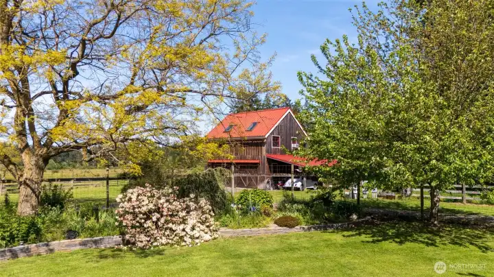 The shop/garage and apartment, seen from the main house garden