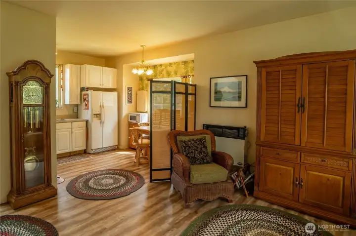 Guesthouse living area looking toward kitchen with eating area
