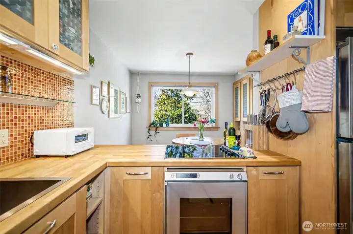 Butcher block countertops and tiled backsplash