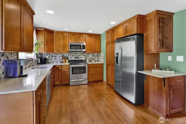 Shaker cabinets and stainless steelappliances.