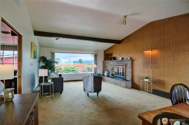 Mid Century vibe with wood fireplace. Mid Century vibe with wood fireplace.