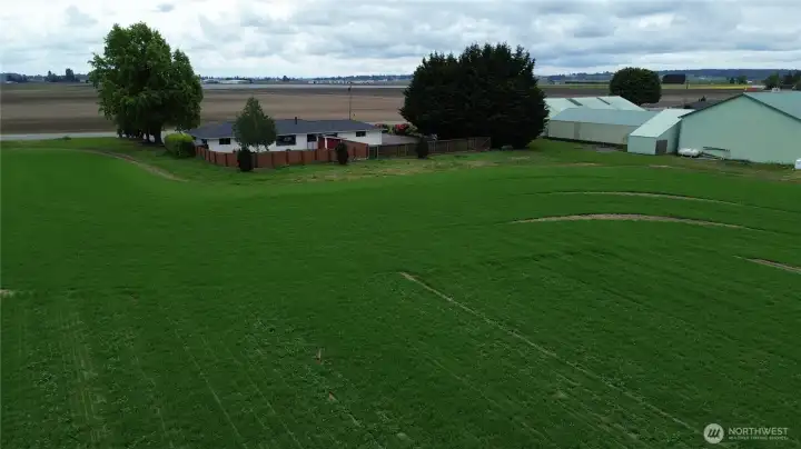 Back view of property currently cultivated with barley by adjacent farm. Back view of property currently cultivated with barley by adjacent farm.
