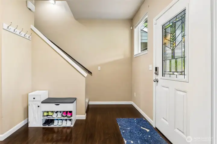 Foyer with room for benches and storage.
