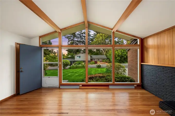 Hardwood floors throughout the home, wood beam accents and brick.
