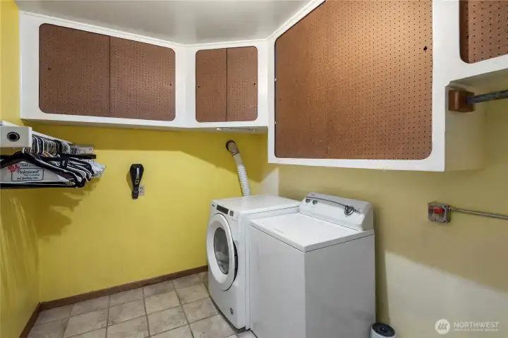 Large laundry Room with lots of storage.