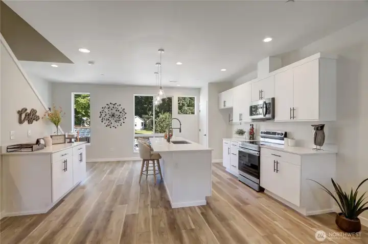 Beautiful quartz counters and stainless appliances make whipping up a meal a breeze.