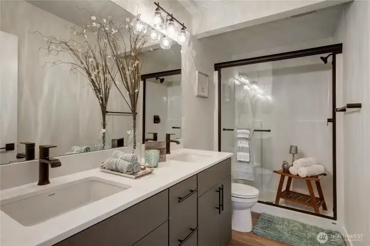 Primary bath with walk-in shower, and the double vanity provides tons of storage.