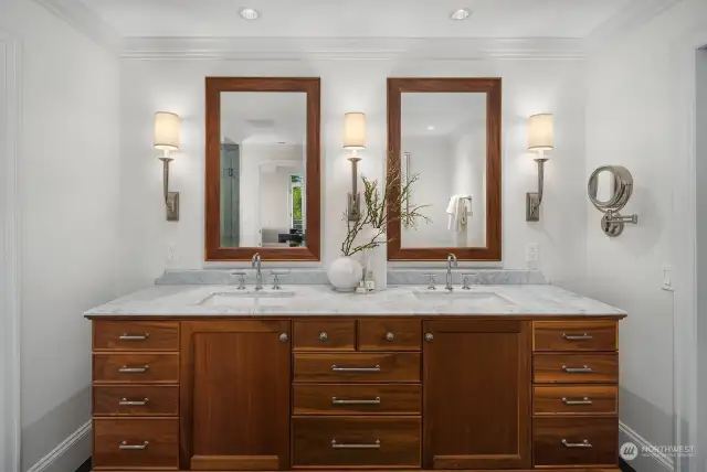 Beautiful new lower-level bathroom with double sinks, updated flooring and lighting.