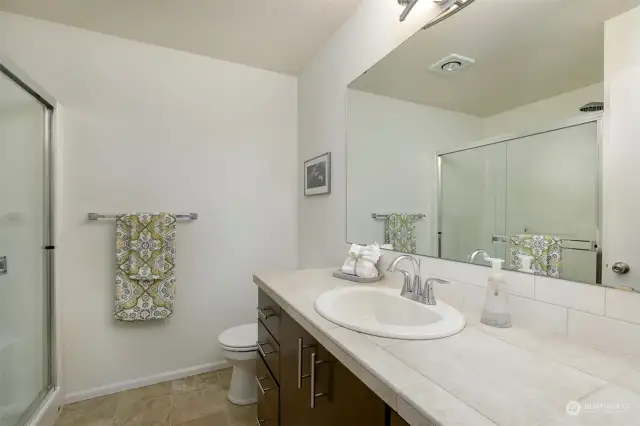 The 3/4 bath is off the primary bedroom tile counter-tops & new flooring