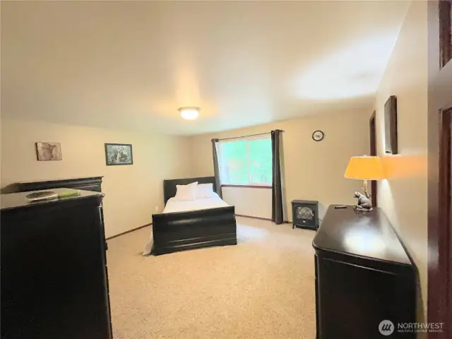 Large Primary Bedroom with a walk in closet.