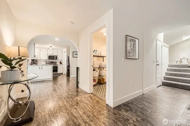 Just off the family room is the laundry room and to the right are steps that lead up to the bonus room.
