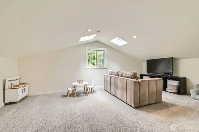 Another view of the bonus room that could flex as a media room, playroom, or home office.