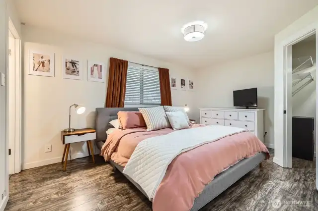 Primary bedroom features a private bath and a walk-in closet.