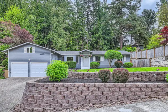 Terraced front yard adds visual appeal while a 2 car garage adds convenience.