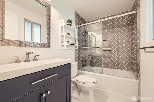 Full bath with tub/shower combo.