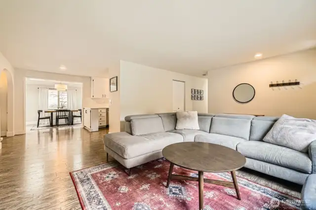 The living room connects seamlessly with the kitchen and the formal dining room for easy flow entertaining.