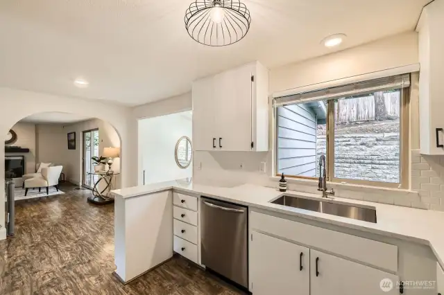 Off the kitchen is the family room, a slider to the deck, and access to the bonus room.