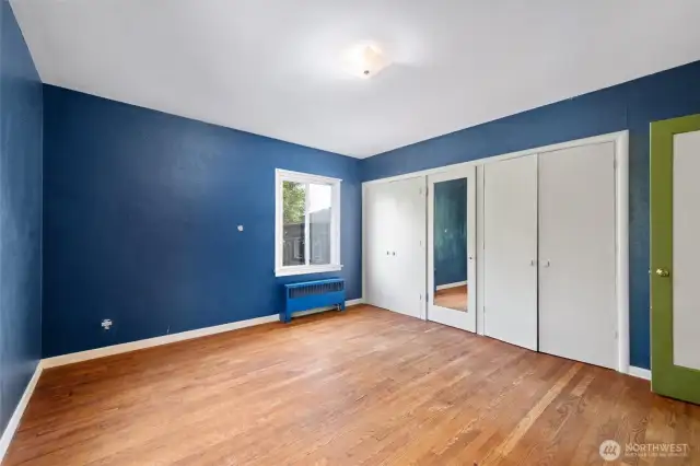 One of 2 main floor bedrooms, also with original hardwood floors.