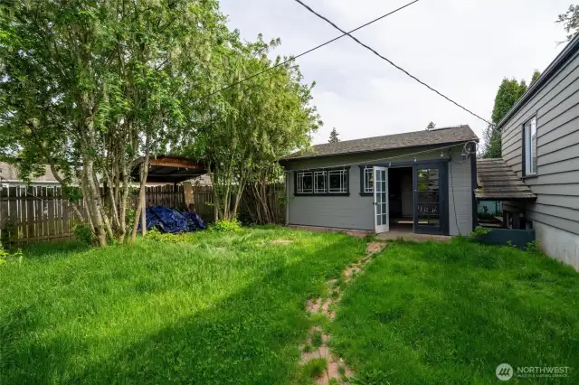 Private, fully fenced backyard with french doors into the good size garage. There is a gate on the side of the yard (direct access from Illinois St) plus a gate in the back from the alley.