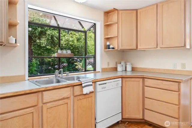 Kitchen with a lovely garden bay window - perfect for indoor herbs.