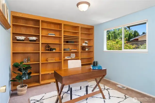 Bedroom #2 with massive, custom ad beautiful built in bookshelf.