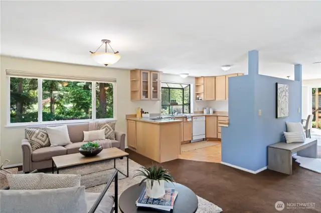 Behind the blue wall is an kitchen appliance garage to house your blender/mixer/toaster. This thoughtful design allows for socializing while cooking.