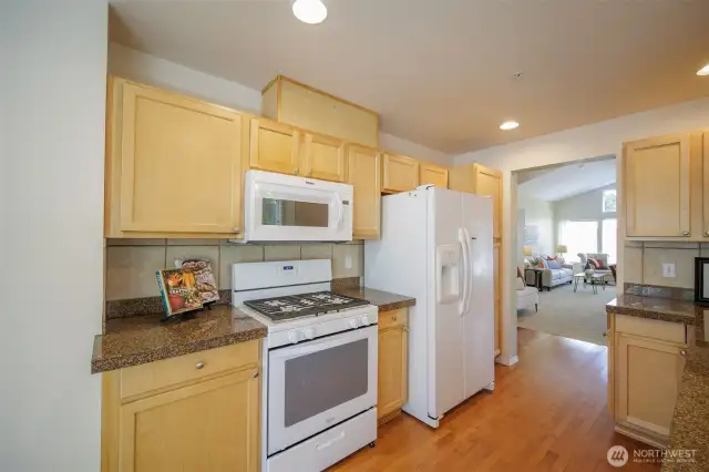 Granite tile counters and gas cooking for the chef.