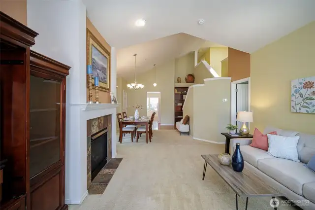The vaulted stairwell features a display shelf.