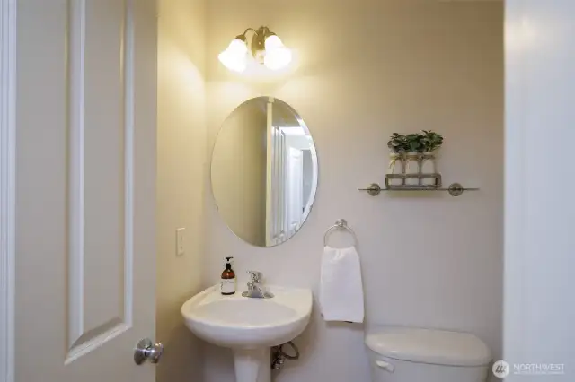 Back downstairs is a discrete powder room.