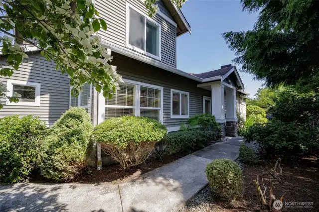 The paved level path around the unit. HOA maintains landscaping.