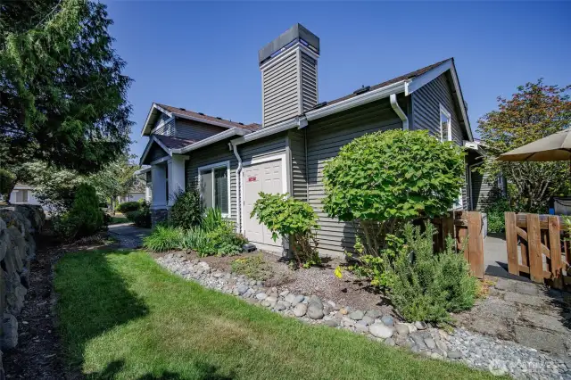 Plenty of sun for your perennial garden. Plus little backyard gate.