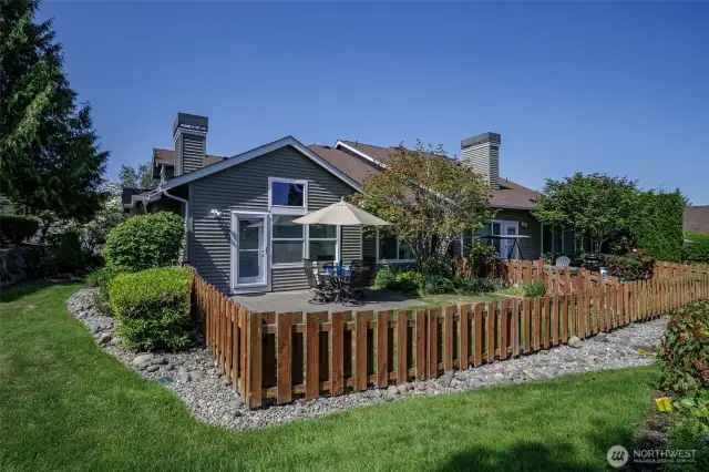 HOA maintained fence and lawn add a cottage charm to the garden.