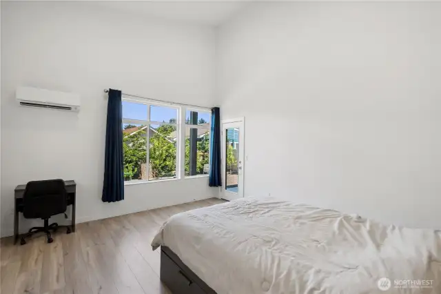 Primary Bedroom with personal mini split and access to back patio