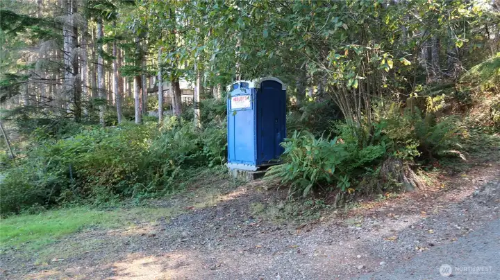 Community boat launch area does have and out house for collins lake members only.
