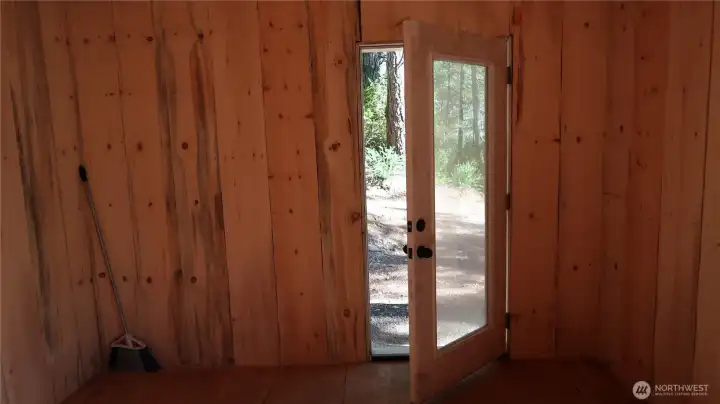 Front door to the shed notice all the woodwork this shed has to off. It's simply amazing and gorgeous.