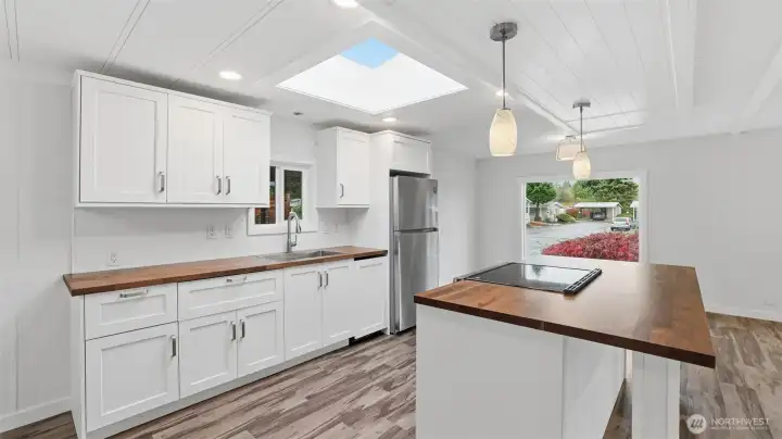 New kitchen with Butcher Block counters and large skylight