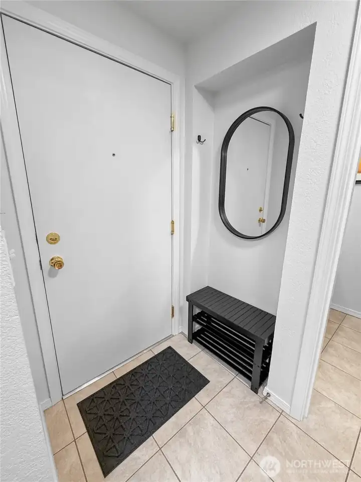 Here is a view of the entryway with the the door closed. The nook is a perfect spot for a shoe shelf, a mirror, and some coat hooks.