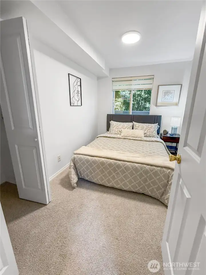 The bedroom is at the end of the hall and is large enough for a queen-size bed. The carpeting could be replaced with wood flooring (buyer to verify).