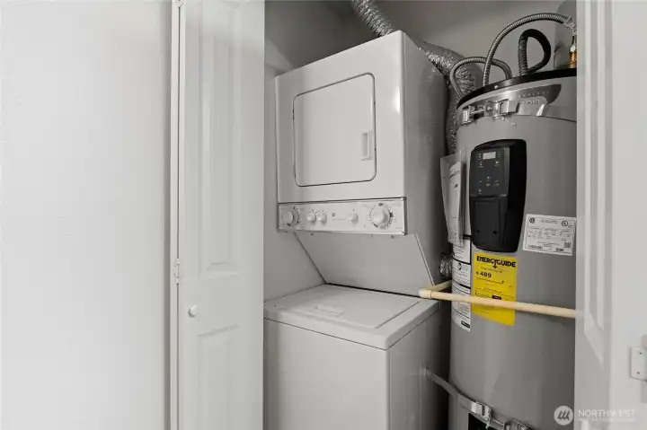 Stackable washer/dryer + new water heater. The kitchen is just to the right of this closet.