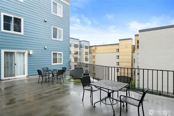 The large patio has multiple tables and plenty of chairs. It's a really nice place to enjoy a cup of coffee in the morning.