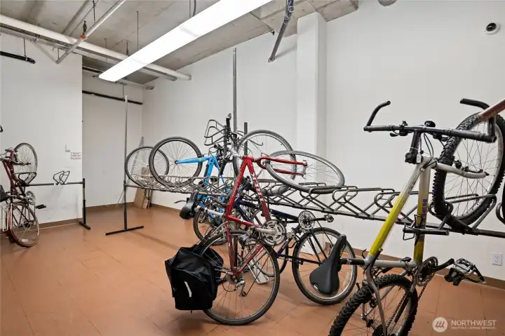 The bike storage is on the parking level. There is a camera for added security.