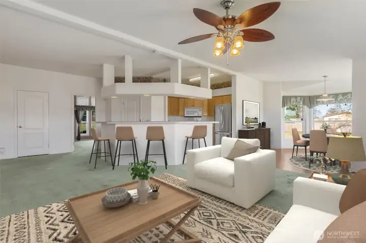 View of kitchen with raised breakfast bar, walk in pantry, opens to family room and an eat-in nook, saturated in natural light.
