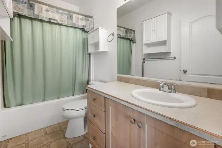 Full main bath off the hall is convenient for guest and secondary bedrooms.