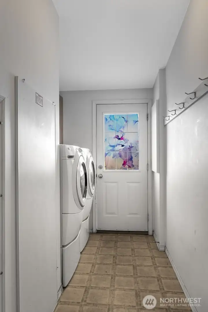 Laundry room is conveniently located off the hall and has ramp access to the spacious patio and back yard. Complete with included washer and dryer.
