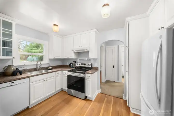 Functional kitchen with backyard view.