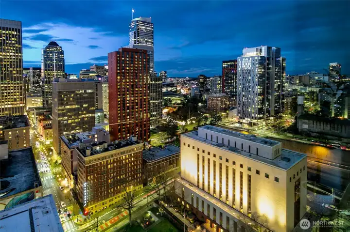 historic court house  up lit at night with lush green landscape