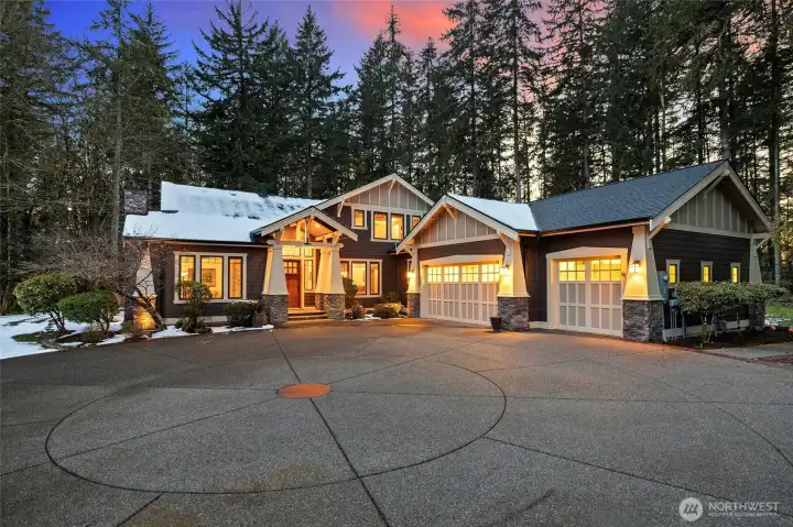 Large circular driveway leads to this grand home