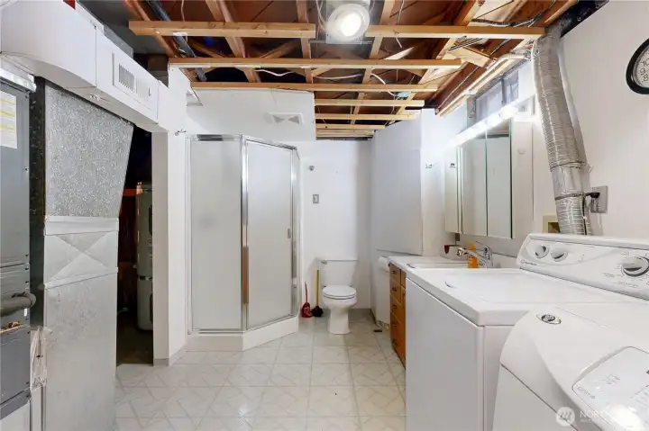 Laundry and half 3/4 bath in basement